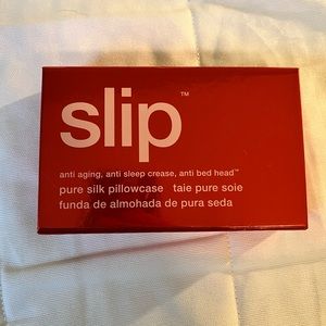 NWT Slip pillow cover still in box. Burnt orange color reg size pillow case.